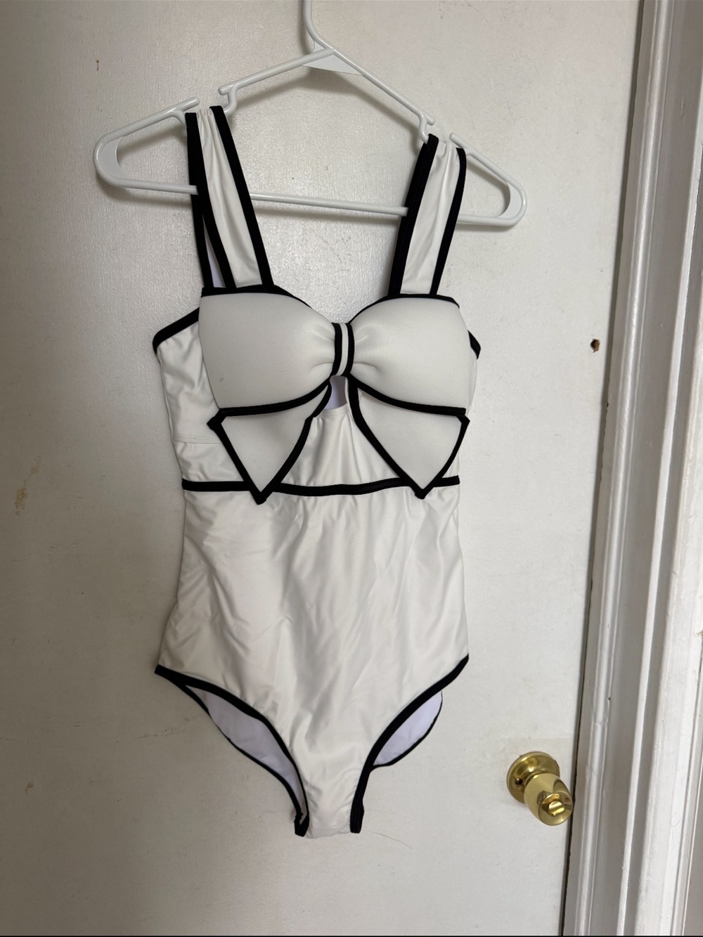 White One-Piece Swimsuit with Black Piping and Bow Detail - never worn.